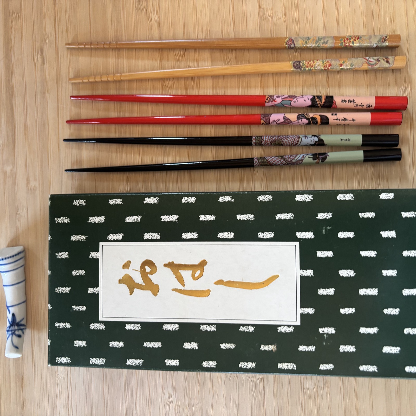 The chopstick drawer — mixed pairs + ceramic rests, gathered over years